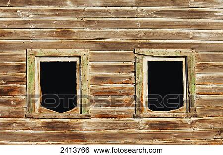 Stock Photograph - Old and weathered windows of a horse barn; St. Albert, Alberta, Canada. Fotosearch