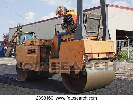 Operator driving steam roller repairing pot holes; Edmonton, Alberta, Canada View Large Photo Image Stock Image - Operator driving steam roller repairing pot holes; Edmonton, Alberta, Canada. Fotosearch