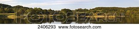 Panoramic landscape reflected in a tranquil lake; Lake District, Cumbria, England View Large Photo Image Stock Image - Panoramic landscape reflected in a tranquil lake; Lake District, Cumbria, England. Fotosearch