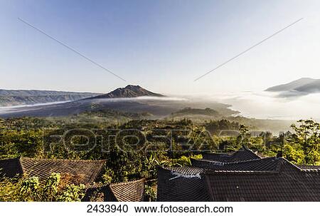 Panoramic view of Mount Batur and Batur Lake at sunrise from Kintamani, Bali, Indonesia View Large Photo Image Stock Image - Panoramic view of Mount Batur and Batur Lake at sunrise from Kintamani, Bali, Indonesia. Fotosearch