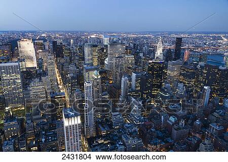 Panoramic view of the skyscrapers and the East River at dusk, as seen from the Empire State Building, New York City, New York, United States View Large Photo Image Picture - Panoramic view of the skyscrapers and the East River at dusk, as seen from the Empire State Building, New York City, New York, United States. Fotosearch