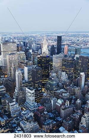 Panoramic view of the skyscrapers and the East River at dusk, as seen from the Empire State Building, New York City, New York, United States View Large Photo Image Stock Image - Panoramic view of the skyscrapers and the East River at dusk, as seen from the Empire State Building, New York City, New York, United States. Fotosearch