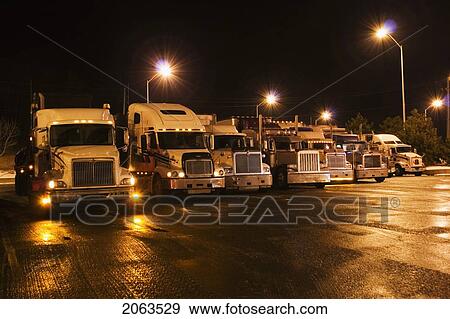 Parking Lot For Transport Trucks At Night; Canada, Ontario View Large Photo Image Stock Photo - Parking Lot For Transport Trucks At Night; Canada, Ontario. Fotosearch