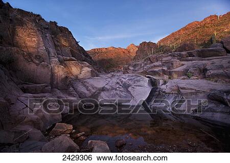 Stock Photograph - Petroglyphs at the Hieroglyphic Canyon Trail, at Gold Canyon, Superstition Mountain Range; Arizona, United States of America. Fotosearch