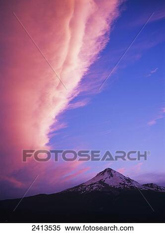 Stock Photography - Pink clouds tower over Mount Hood; Dufur, Oregon, United States of America. Fotosearch