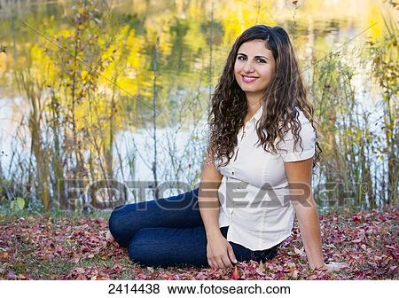 Portait of a woman in a park in autumn; Edmonton, Alberta, Canada View Large Photo Image Stock Photo - Portait of a woman in a park in autumn; Edmonton, Alberta, Canada. Fotosearch