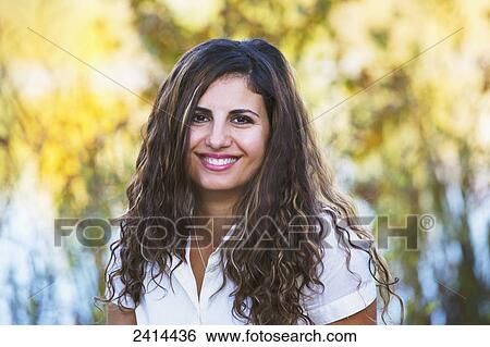 Portait of a woman in a park in autumn; Edmonton, Alberta, Canada View Large Photo Image Stock Photograph - Portait of a woman in a park in autumn; Edmonton, Alberta, Canada. Fotosearch