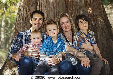 Portait of a young family in a park; Langley, British Columbia, Canada View Large Photo Image Stock Image - Portait of a young family in a park; Langley, British Columbia, Canada. Fotosearch