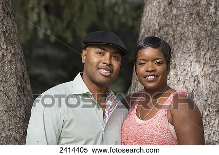 Stock Photography - Portrait of a couple in a park; Edmonton, Alberta, Canada. Fotosearch