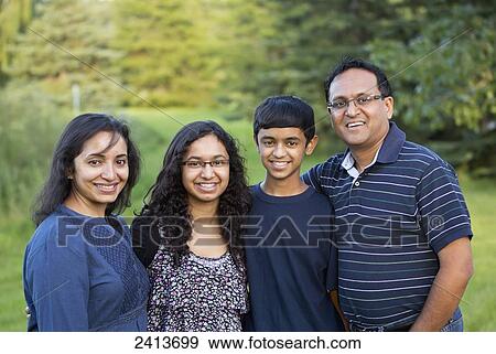 Portrait of a family in a park in autumn; Edmonton, Alberta, Canada View Large Photo Image Stock Photo - Portrait of a family in a park in autumn; Edmonton, Alberta, Canada. Fotosearch
