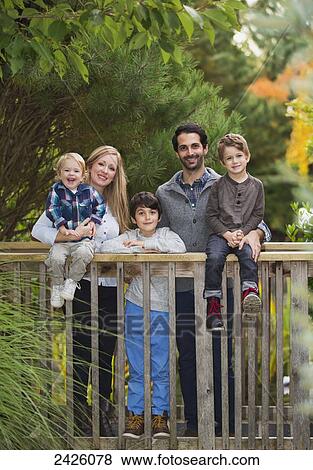Portrait of a family in a park; Langley, British Columbia, Canada View Large Photo Image Stock Photo - Portrait of a family in a park; Langley, British Columbia, Canada. Fotosearch