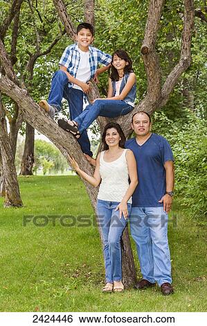 Portrait of a family in a park; Edmonton, Alberta, Canada View Large Photo Image Stock Photograph - Portrait of a family in a park; Edmonton, Alberta, Canada. Fotosearch