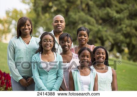 Portrait of a family with five daughters in a park; Edmonton, Alberta, Canada View Large Photo Image Stock Photo - Portrait of a family with five daughters in a park; Edmonton, Alberta, Canada. Fotosearch