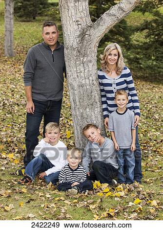 Portrait of a family with four sons in a park in autumn; Edmonton, Alberta, Canada View Large Photo Image Stock Photo - Portrait of a family with four sons in a park in autumn; Edmonton, Alberta, Canada. Fotosearch