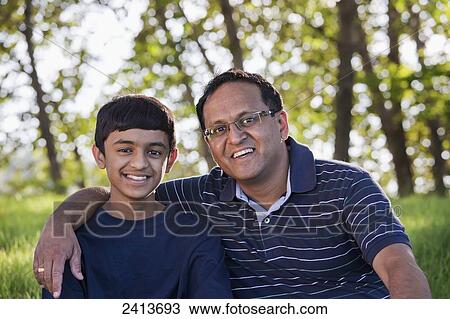Portrait of a father and son in a park; Edmonton, Alberta, Canada View Large Photo Image Stock Image - Portrait of a father and son in a park; Edmonton, Alberta, Canada. Fotosearch