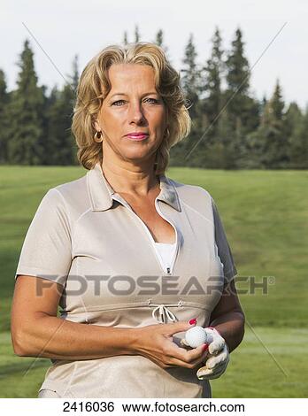 Portrait of a female golfer on a golf course; Edmonton, Alberta, Canada View Large Photo Image Stock Photograph - Portrait of a female golfer on a golf course; Edmonton, Alberta, Canada. Fotosearch