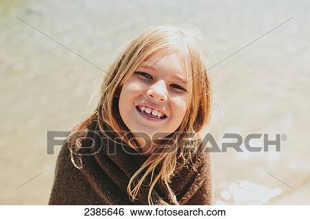 Portrait of a girl wrapped in a towel with water in the background; Peachland, British Columbia, Canada View Large Photo Image Stock Photograph - Portrait of a girl wrapped in a towel with water in the background; Peachland, British Columbia, Canada. Fotosearch