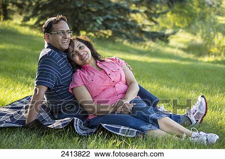 Portrait of a husband and wife spending quality time together in a park; Edmonton, Alberta, Canada View Large Photo Image Stock Image - Portrait of a husband and wife spending quality time together in a park; Edmonton, Alberta, Canada. Fotosearch