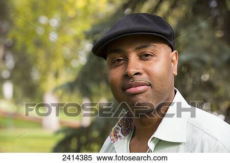 Portrait of a man in a park; Edmonton, Alberta, Canada View Large Photo Image Stock Photography - Portrait of a man in a park; Edmonton, Alberta, Canada. Fotosearch