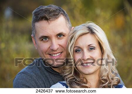 Portrait of a married couple in a park in autumn; Edmonton, Alberta, Canada View Large Photo Image Stock Photo - Portrait of a married couple in a park in autumn; Edmonton, Alberta, Canada. Fotosearch