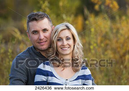 Portrait of a married couple in a park in autumn; Edmonton, Alberta, Canada View Large Photo Image Stock Photograph - Portrait of a married couple in a park in autumn; Edmonton, Alberta, Canada. Fotosearch