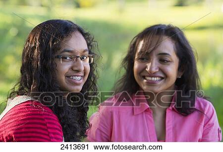 Portrait of a mother and daughter together outdoors; Edmonton, Alberta, Canada View Large Photo Image Stock Image - Portrait of a mother and daughter together outdoors; Edmonton, Alberta, Canada. Fotosearch