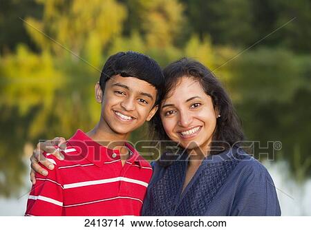 Portrait of a mother and son in a park in autumn; Alberta, Canada View Large Photo Image Picture - Portrait of a mother and son in a park in autumn; Alberta, Canada. Fotosearch