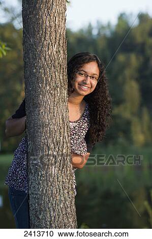 Portrait of a teenage girl beside a tree; Edmonton, Alberta, Canada View Large Photo Image Stock Image - Portrait of a teenage girl beside a tree; Edmonton, Alberta, Canada. Fotosearch