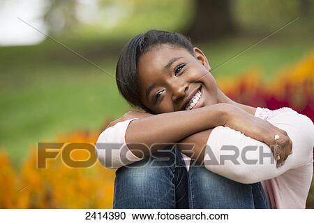 Portrait of a teenage girl in a park; Edmonton, Alberta, Canada View Large Photo Image Stock Image - Portrait of a teenage girl in a park; Edmonton, Alberta, Canada. Fotosearch