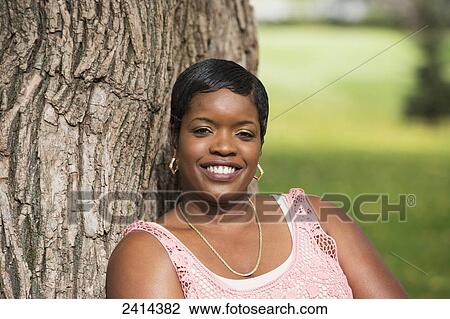 Portrait of a woman in a park; Edmonton, Alberta, Canada View Large Photo Image Stock Image - Portrait of a woman in a park; Edmonton, Alberta, Canada. Fotosearch