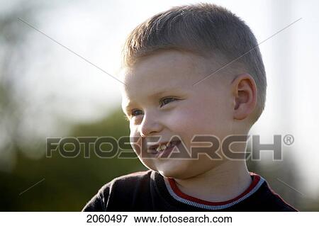Portrait Of Boy Smiling Outdoors View Large Photo Image Stock Photo - Portrait Of Boy Smiling Outdoors. Fotosearch