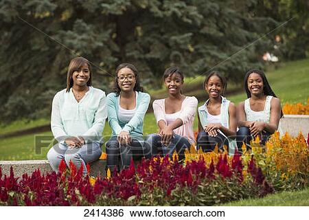 Portrait of five sisters in a park; Edmonton, Alberta, Canada View Large Photo Image Stock Photograph - Portrait of five sisters in a park; Edmonton, Alberta, Canada. Fotosearch