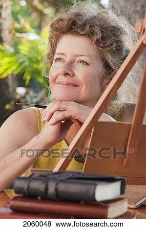 Portrait Of Woman Painting Outdoors, Manitoba, Canada View Large Photo Image Stock Photo - Portrait Of Woman Painting Outdoors, Manitoba, Canada. Fotosearch