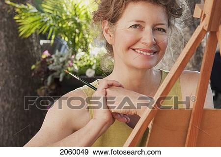 Portrait Of Woman Painting Outdoors, Manitoba, Canada View Large Photo Image Stock Photo - Portrait Of Woman Painting Outdoors, Manitoba, Canada. Fotosearch