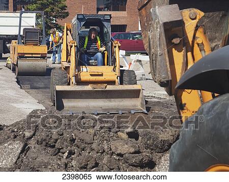 Stock Photography - Pot hole work crew repairing parking lot; Edmonton, Alberta, Canada. Fotosearch