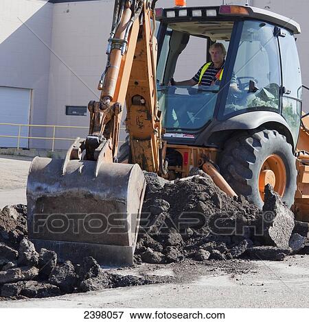 Stock Photo - Pothole work crew repairing parking lot; Edmonton, Alberta, Canada. Fotosearch