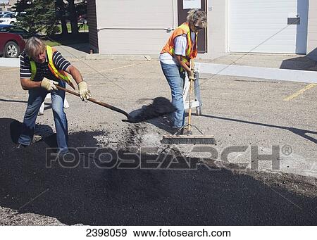 Pothole work crew repairing parking lot; Edmonton, Alberta, Canada View Large Photo Image Stock Photo - Pothole work crew repairing parking lot; Edmonton, Alberta, Canada. Fotosearch