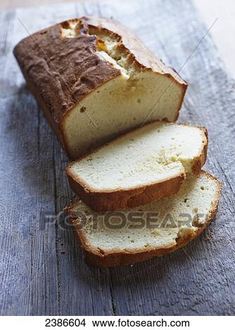 Picture - Pound cake sitting on a barnboard. Fotosearch