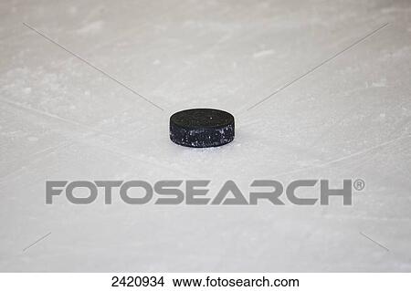 Puck on the ice; Edmonton, Alberta, Canada View Large Photo Image Picture - Puck on the ice; Edmonton, Alberta, Canada. Fotosearch