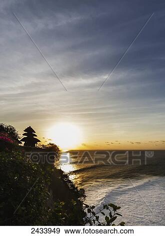 Pura Luhur Ulu Watu sea temple at sunset, Bali, Indonesia View Large Photo Image Stock Photo - Pura Luhur Ulu Watu sea temple at sunset, Bali, Indonesia. Fotosearch