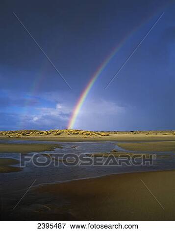 Rainbow appears over the mouth of the Siltcoos River; Florence, Oregon, United States of America View Large Photo Image Stock Photo - Rainbow appears over the mouth of the Siltcoos River; Florence, Oregon, United States of America. Fotosearch