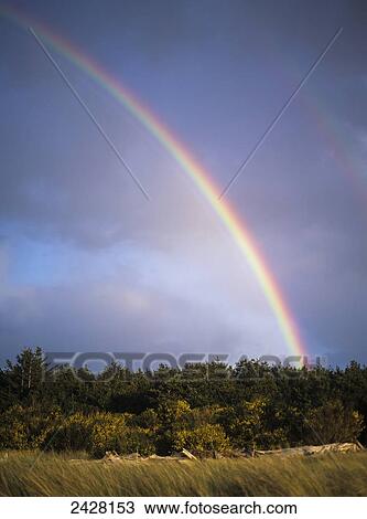 Stock Image - Rainbows are common along the Oregon coast; Florence, Oregon, United States of America. Fotosearch