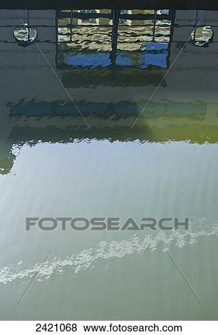 Reflection of a wall, window and blue sky in water; London, England View Large Photo Image Stock Photo - Reflection of a wall, window and blue sky in water; London, England. Fotosearch