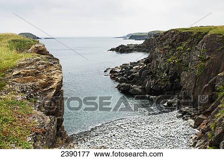 Rugged cliffs along the atlantic coastline; Little Catalina, Newfoundland and Labrador, Canada View Large Photo Image Stock Photo - Rugged cliffs along the atlantic coastline; Little Catalina, Newfoundland and Labrador, Canada. Fotosearch
