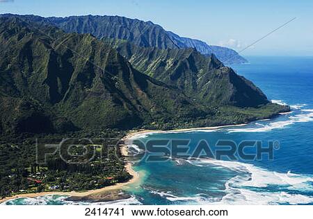 Rugged mountains along the coastline and the surf meets the beach; Haena, Hawaii, United States of America View Large Photo Image Stock Image - Rugged mountains along the coastline and the surf meets the beach; Haena, Hawaii, United States of America. Fotosearch