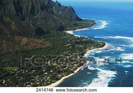 Rugged mountains along the coastline and the surf meets the beach; Haena, Hawaii, United States of America View Large Photo Image Stock Photograph - Rugged mountains along the coastline and the surf meets the beach; Haena, Hawaii, United States of America. Fotosearch