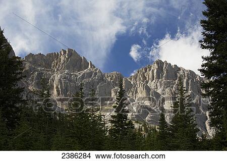 Rugged rock face of the Canadian rocky mountains; Banff, Alberta, Canada View Large Photo Image Picture - Rugged rock face of the Canadian rocky mountains; Banff, Alberta, Canada. Fotosearch
