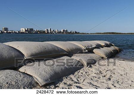 Sand bags piled up along the beach to the water's edge; Caloundra, Queensland, Australia View Large Photo Image Stock Image - Sand bags piled up along the beach to the water's edge; Caloundra, Queensland, Australia. Fotosearch