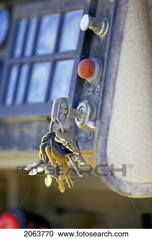 Stock Image - Set Of Keys In Ignition Of Machine; Canada, Ontario, Hamilton (Composting Facility). Fotosearch