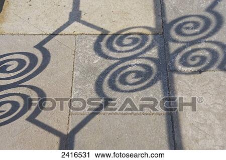Shadow of ornate fence detail on the ground; Cite, France View Large Photo Image Stock Image - Shadow of ornate fence detail on the ground; Cite, France. Fotosearch